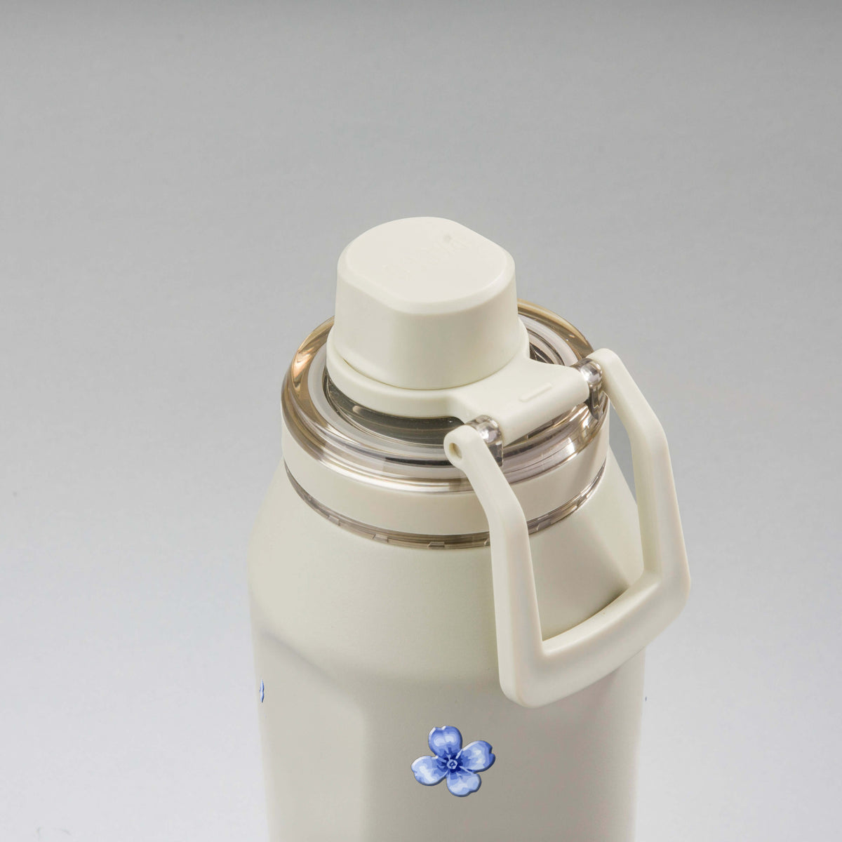 Garrafa Térmica PACCO Vyta 950ml Jardim Azul Creme, vista de cima com a alça na frente