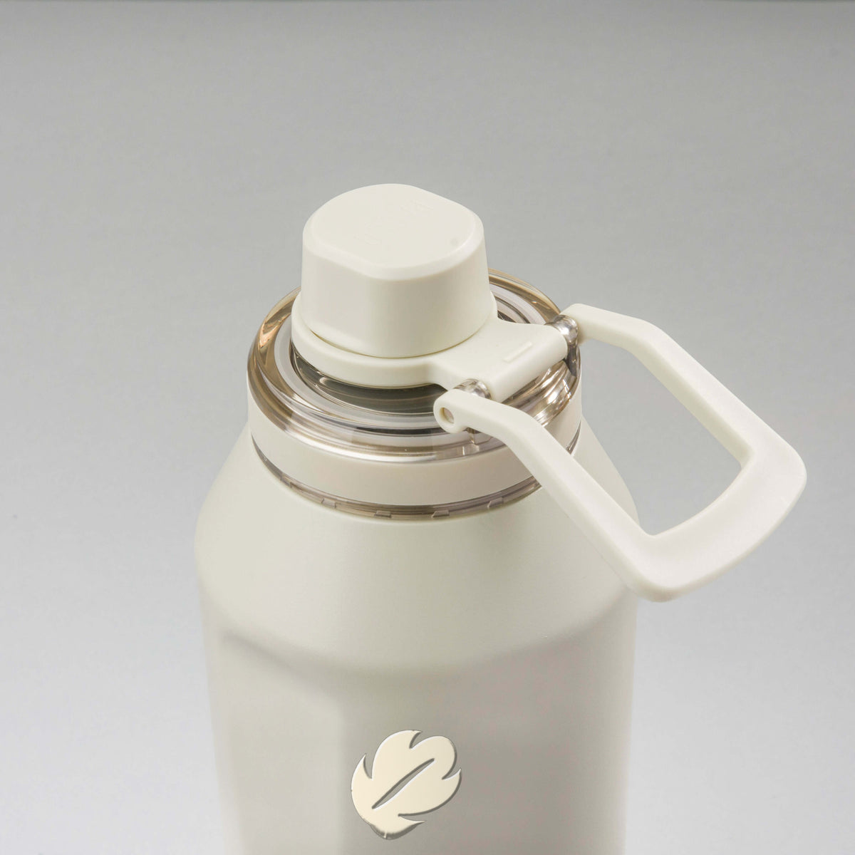 Garrafa Térmica PACCO Vyta 1200ml Folhas Creme Creme, vista de cima com a alça de lado