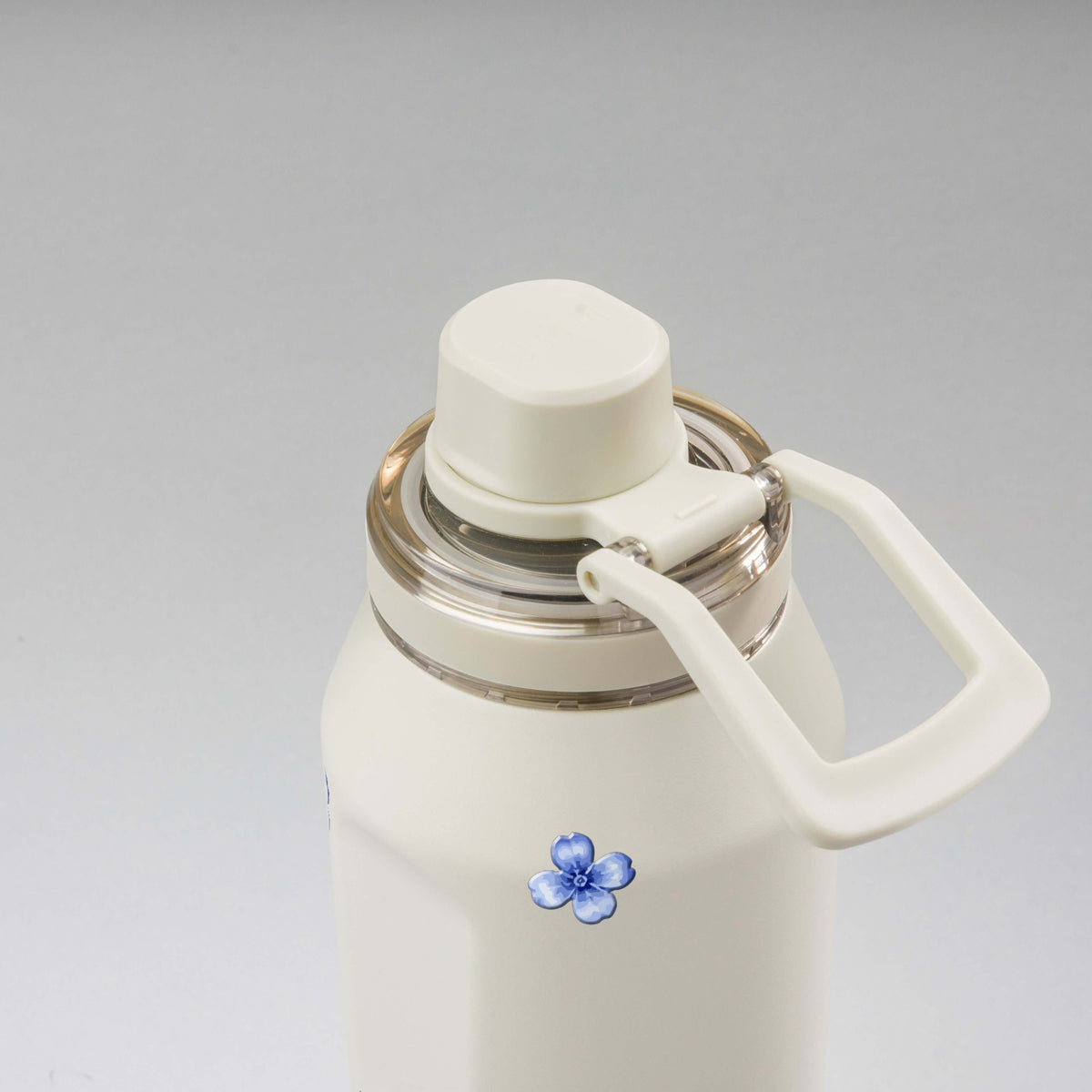 Garrafa Térmica PACCO Vyta 950ml Jardim Azul Creme, vista de cima com a alça de lado