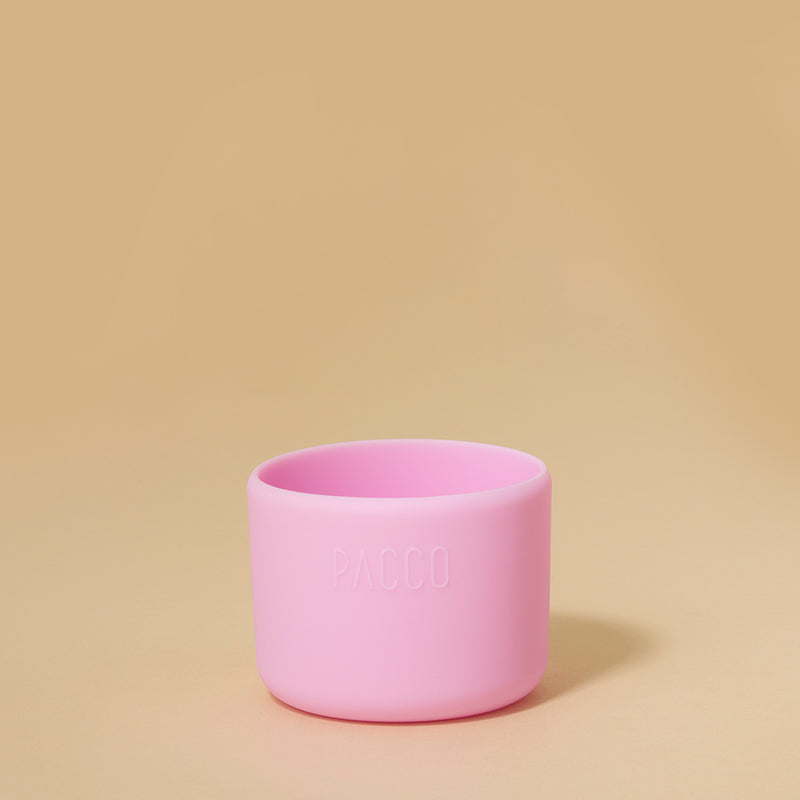 Capa de Silicone PACCO Hydra Base PEQUENO, proteção elegante para garrafas Hydra, rosa claro, em fundo bege.