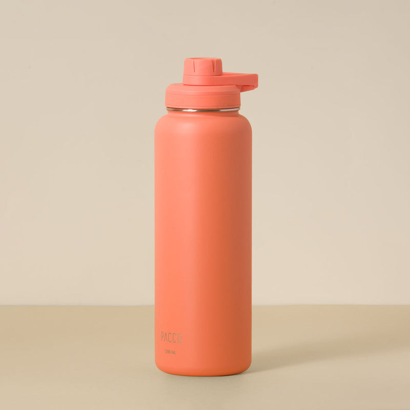 Garrafa Térmica PACCO Hydrav2 1200ml coral com design moderno, ideal para manter bebidas frias por 24h e quentes por 12h.
