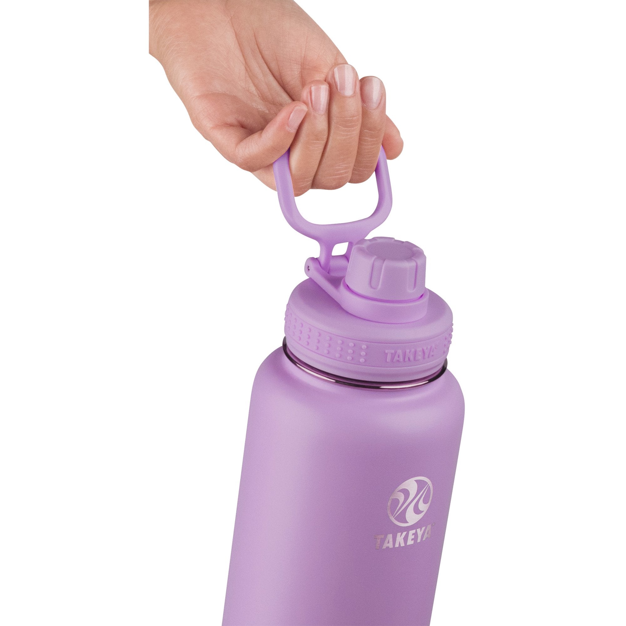 Pessoa segurando Garrafa Térmica Takeya Actives 946ml em cor lilás com tampa prática.