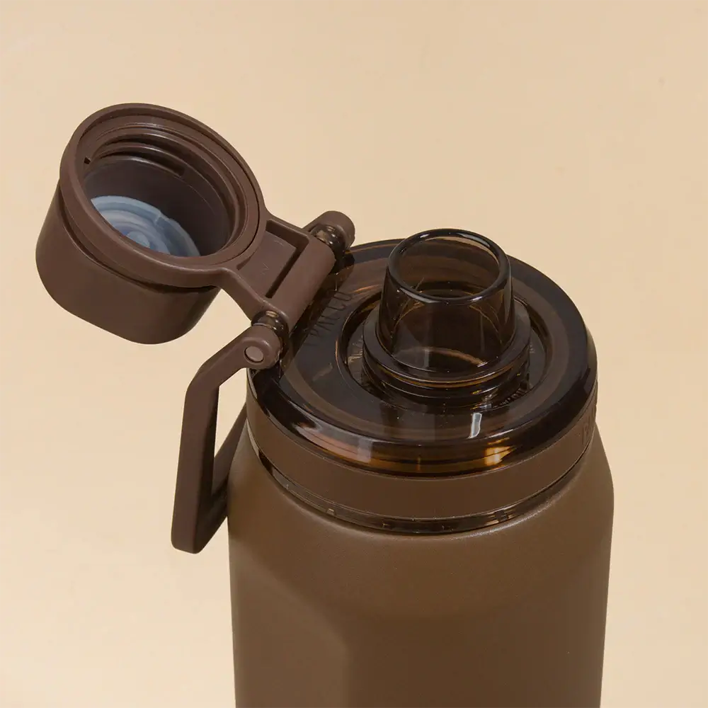 Tampa aberta da Garrafa Térmica PACCO Vyta 500ml em inox, mostrando o interior com isolamento a vácuo para conservação térmica.