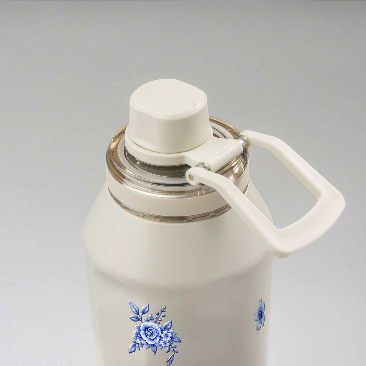 Garrafa Térmica PACCO Vyta 1200ml Jardim Azul Creme, vista de cima com a alça de lado