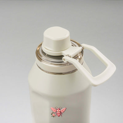 Garrafa Térmica PACCO Vyta 1200ml Rosé Romântico Creme, vista de cima com a alça de lado