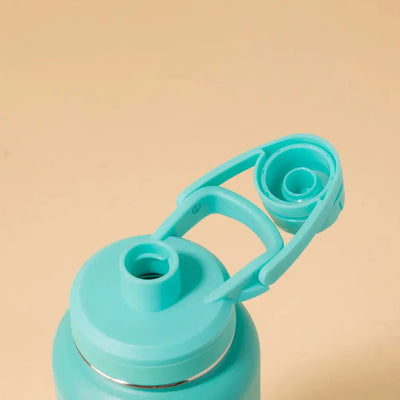 Tampa e bocal da Garrafa Térmica PACCO Hydrav2 1200ml em detalhe, destacando o design ergonômico e funcionalidade avançada.