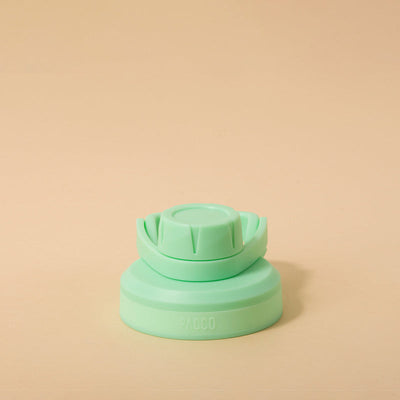 Tampa PACCO Stiff verde com design arrojado e vedação em silicone, ideal para transporte seguro sem vazamentos.