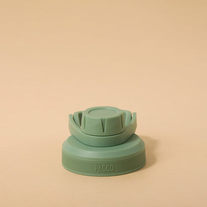 Tampa PACCO Stiff em polipropileno verde com vedação em silicone, projetada para evitar vazamentos, ideal para transporte seguro de garrafas.