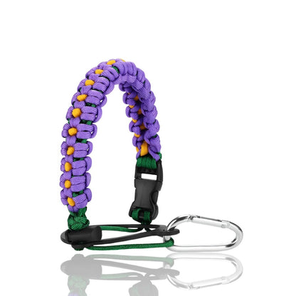 Alça de Mão - Floral roxa com acolchoamento ergonômico e design ajustável para transporte confortável de garrafa.