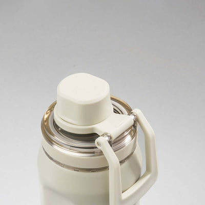 Tampa e alça da Garrafa Térmica PACCO Vyta 350ml em aço inox 18/10, destacando seu design moderno e durabilidade.