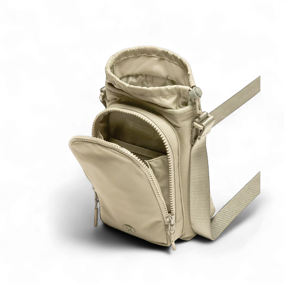 Bolsa para Garrafa Térmica - Cross Bottle Lululemon em beige, com compartimentos abertos, mostrando espaço para garrafa e itens pessoais.