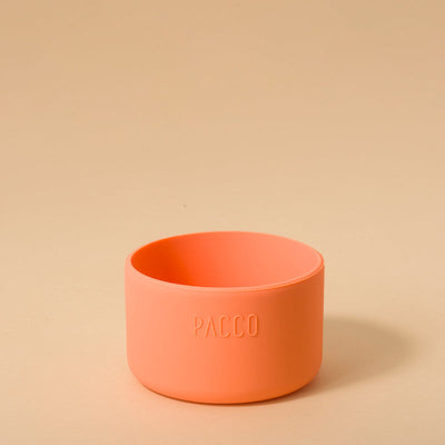 Capa de Silicone PACCO Hydra Base Grande laranja sobre fundo bege, proteção para garrafas PACCO Hydra V2 e V3.