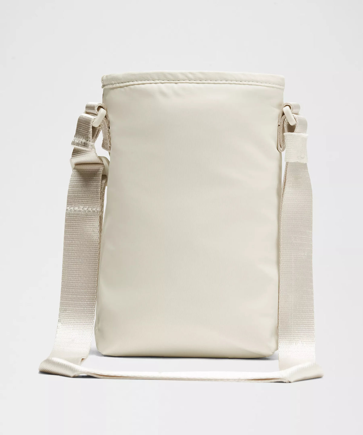 Bolsa para Garrafa Térmica - Cross Bottle Lululemon bege, compacta e leve, ideal para transportar garrafas e itens essenciais.