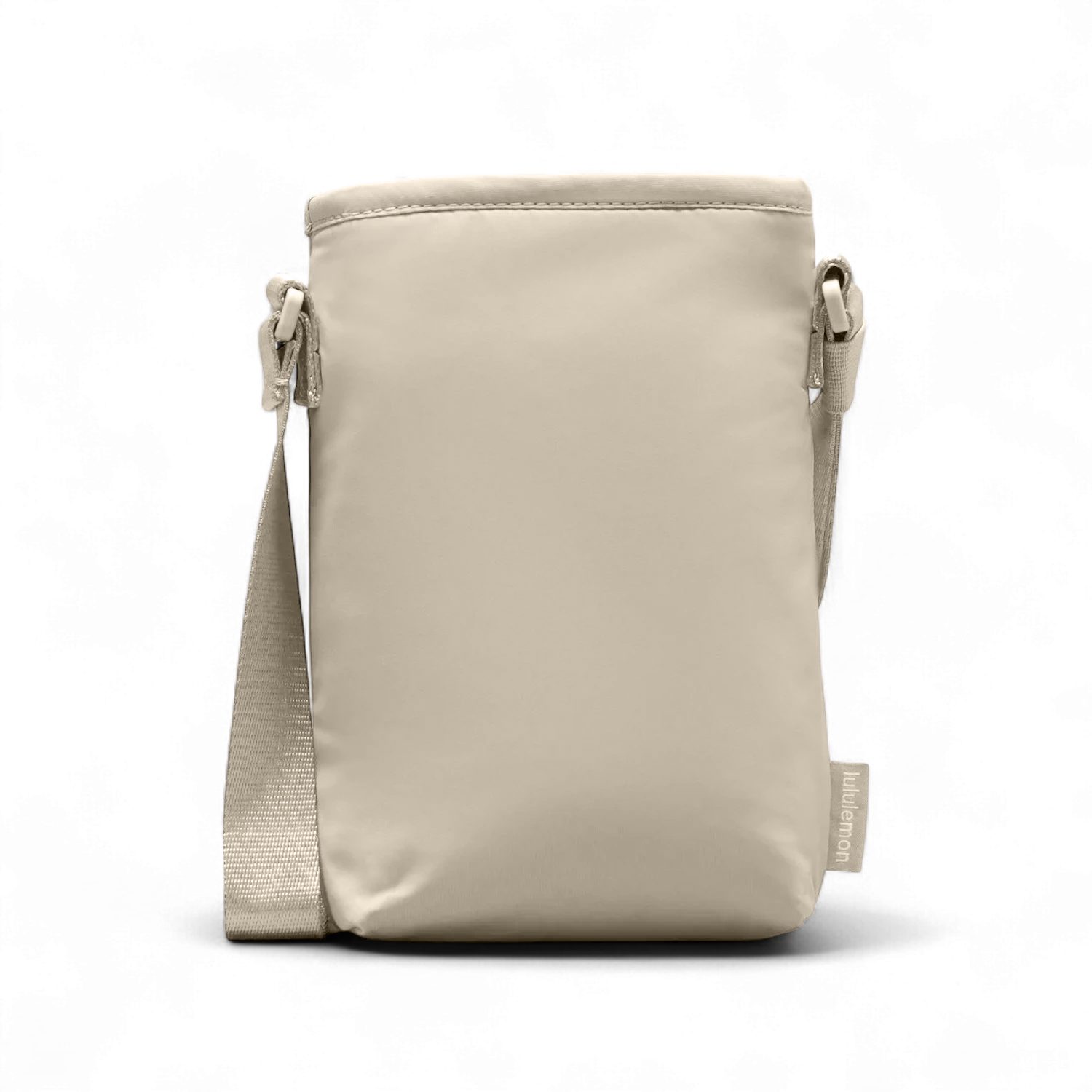 Bolsa para Garrafa Térmica - Cross Bottle Lululemon em cor bege, bolsa compacta e prática para transportar garrafas e itens essenciais.