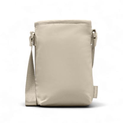 Bolsa para Garrafa Térmica - Cross Bottle Lululemon em cor bege, bolsa compacta e prática para transportar garrafas e itens essenciais.