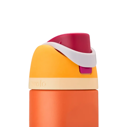 Garrafa térmica Owala FreeSip laranja e amarela com design inteligente, capacidade de 710 ml.